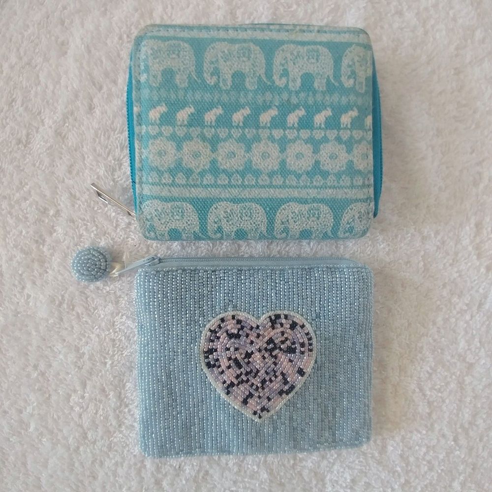 Bundle of two blue wallets/coin purses.